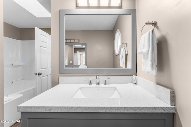 bathroom featuring shower / bathtub combination and sink