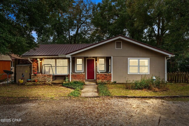 view of front of home with a storage shed