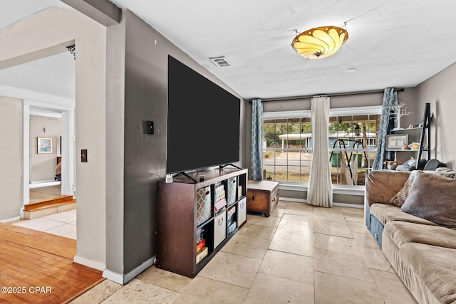 living room with light tile patterned floors