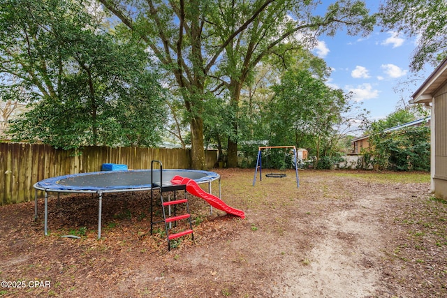 view of jungle gym featuring a trampoline