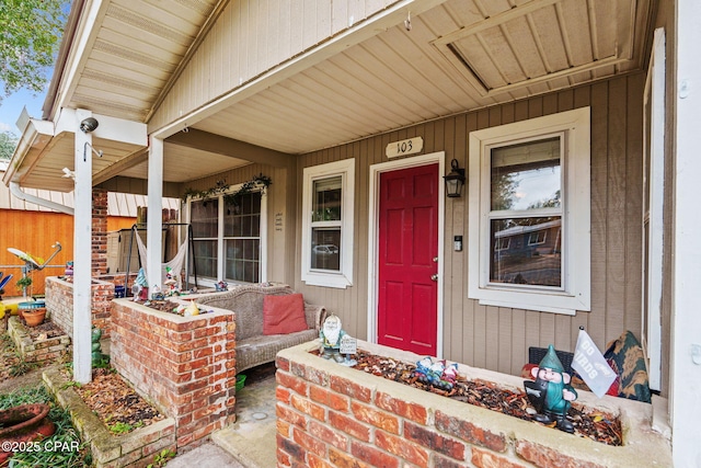 doorway to property featuring a porch