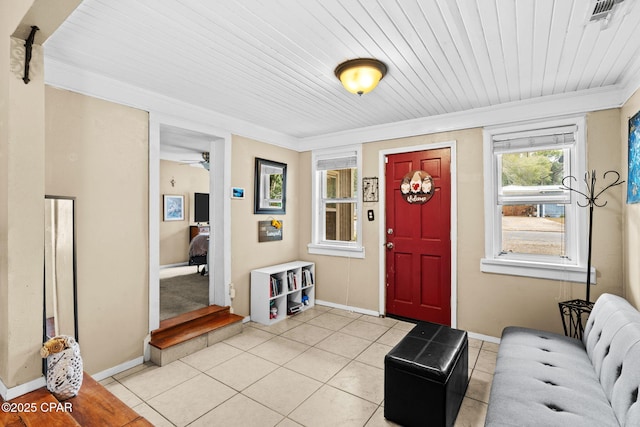 tiled foyer with wood ceiling and ornamental molding