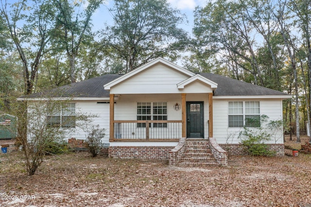 single story home with a porch