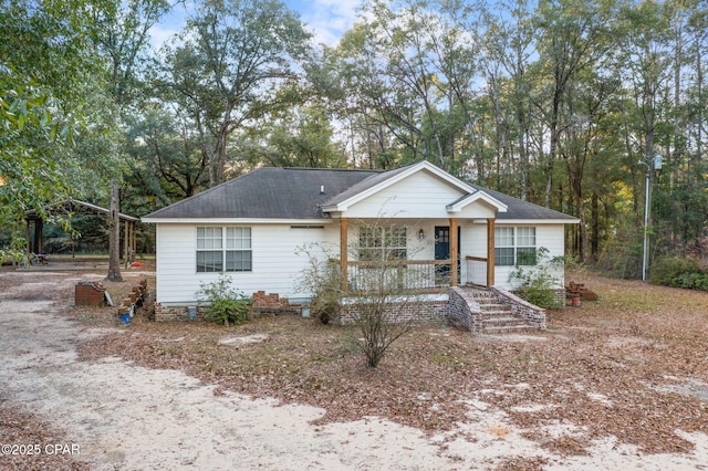 ranch-style home featuring covered porch