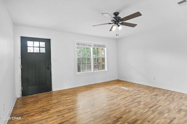 foyer entrance with hardwood / wood-style flooring and ceiling fan