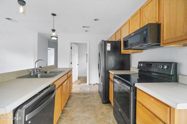 kitchen with sink, decorative light fixtures, black appliances, and light brown cabinets