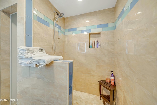 bathroom with a tile shower