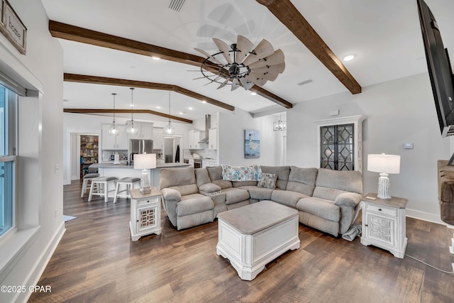 living room featuring ceiling fan, dark hardwood / wood-style floors, and vaulted ceiling with beams