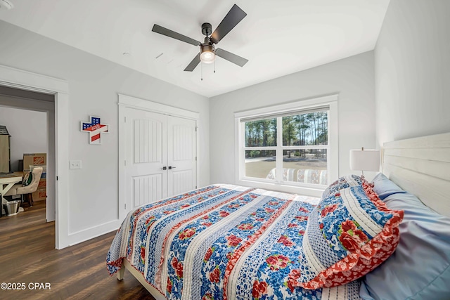 bedroom with ceiling fan, dark hardwood / wood-style floors, and a closet