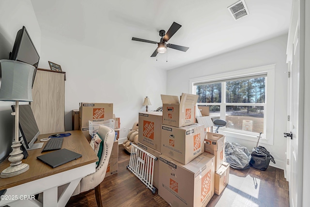 office space featuring dark wood-type flooring, ceiling fan, and a wealth of natural light