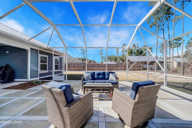 view of patio / terrace featuring an outdoor hangout area and glass enclosure