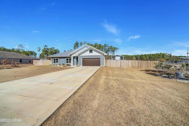 ranch-style home featuring a garage and a front lawn