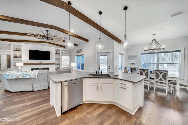 kitchen with white cabinetry, sink, decorative light fixtures, and dishwasher