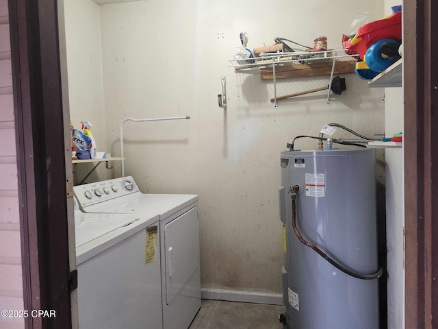 washroom featuring water heater and washer and dryer