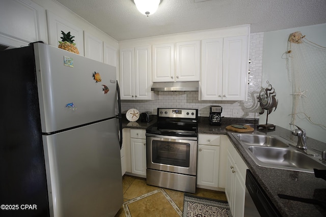 kitchen with a textured ceiling, appliances with stainless steel finishes, white cabinets, and sink