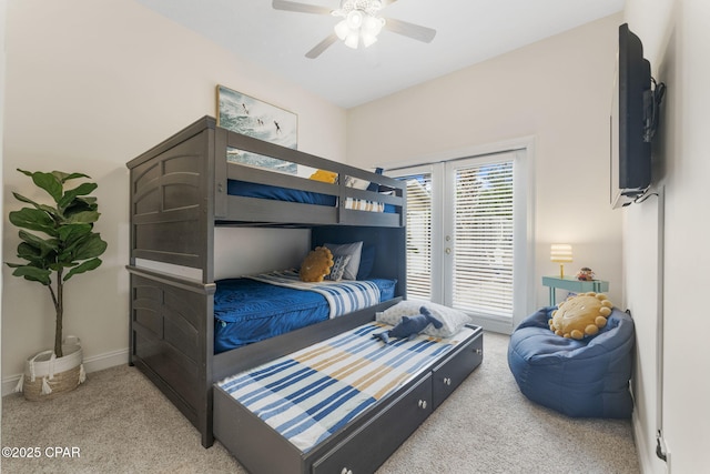 carpeted bedroom featuring access to exterior and ceiling fan