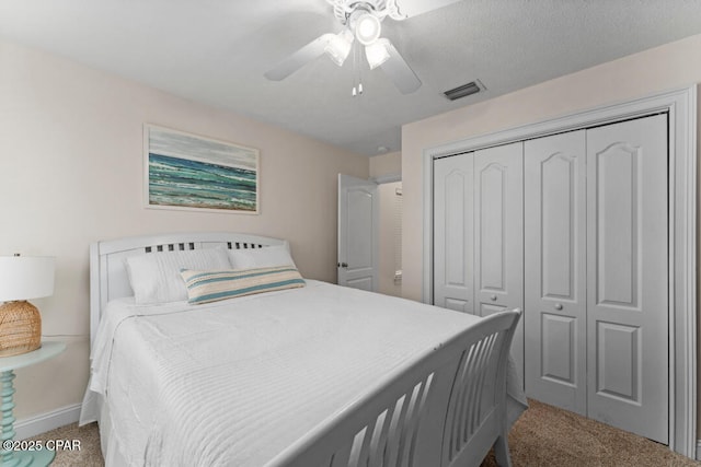 bedroom featuring light carpet, a closet, and ceiling fan