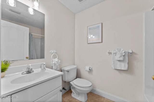 bathroom featuring tile patterned floors, toilet, curtained shower, and vanity