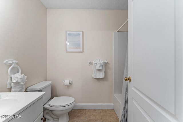 full bathroom with tile patterned floors, bathtub / shower combination, toilet, a textured ceiling, and vanity