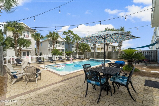 view of swimming pool with a patio