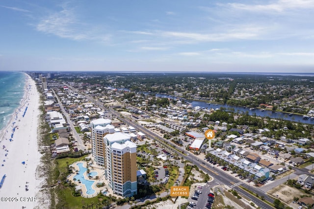 drone / aerial view with a beach view and a water view