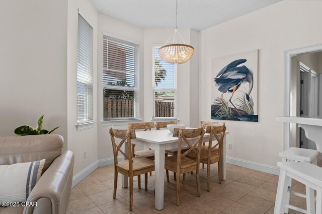 dining area featuring light tile patterned floors