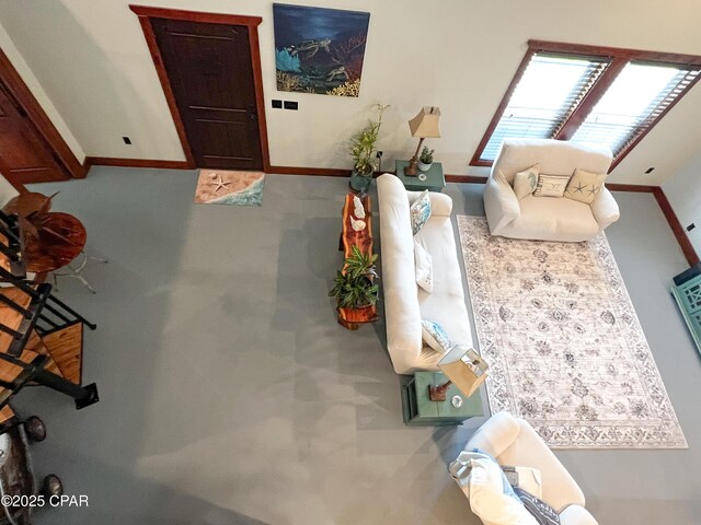 living area featuring baseboards