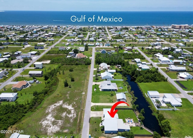 aerial view with a residential view and a water view