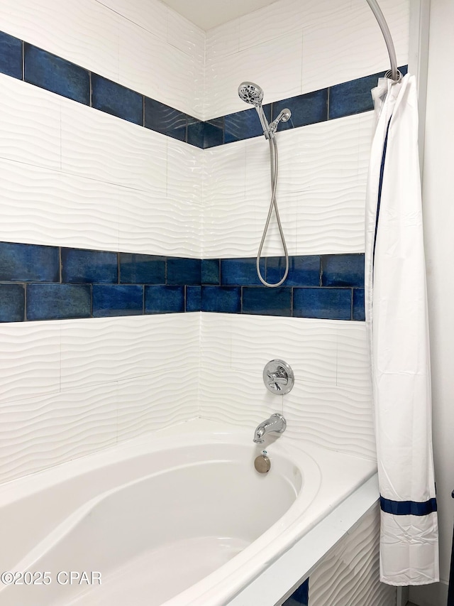 bathroom featuring shower / bath combo with shower curtain