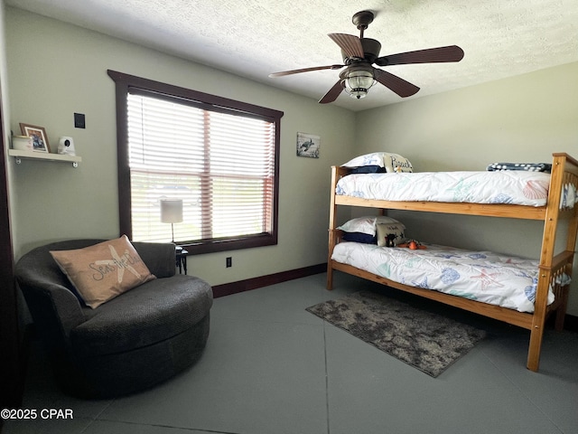 bedroom featuring baseboards, a ceiling fan, and a textured ceiling