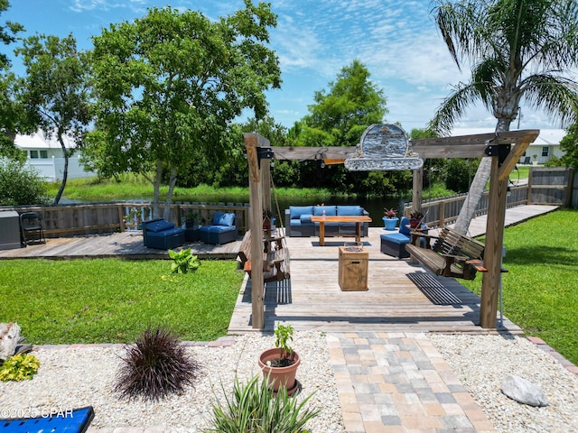 view of patio with outdoor lounge area, a deck, and fence