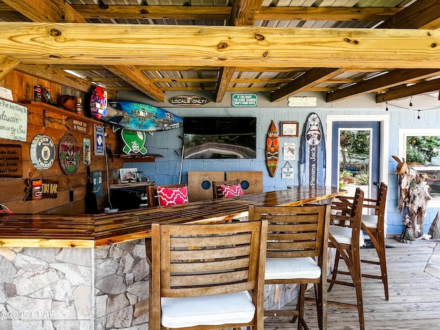 bar featuring wooden ceiling, beamed ceiling, and wood-type flooring