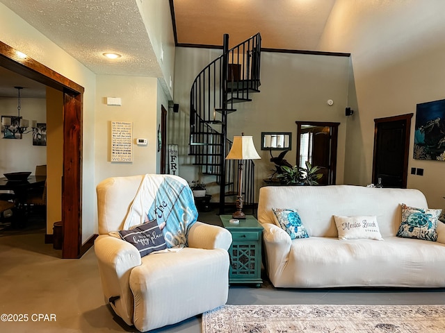 living room with an inviting chandelier and stairway