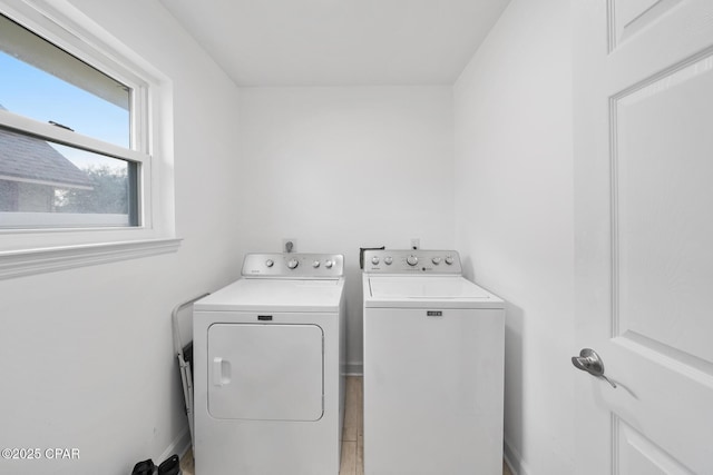 washroom featuring washing machine and dryer