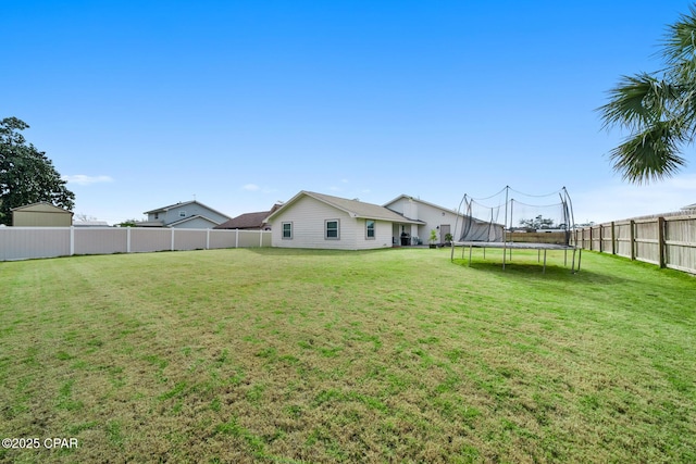 view of yard with a trampoline