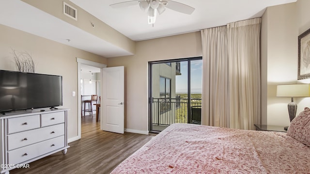 bedroom with ceiling fan, dark hardwood / wood-style floors, and access to outside