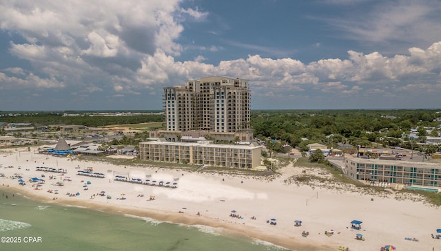 birds eye view of property with a water view and a view of the beach