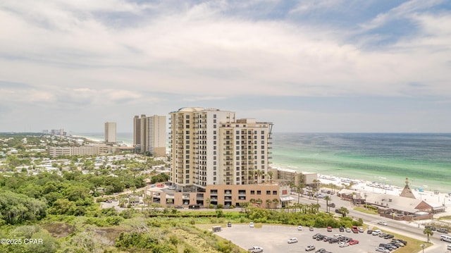 aerial view with a water view and a beach view