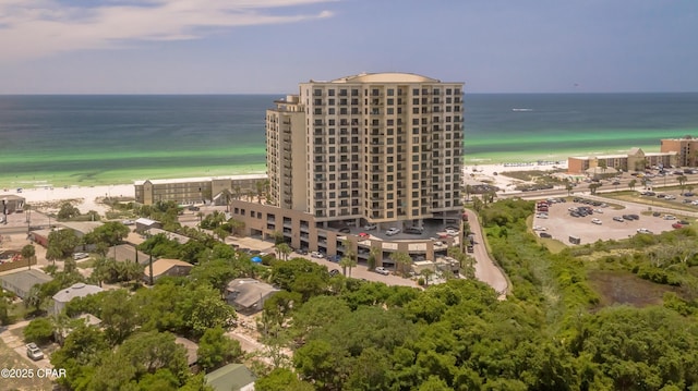 bird's eye view with a water view and a view of the beach