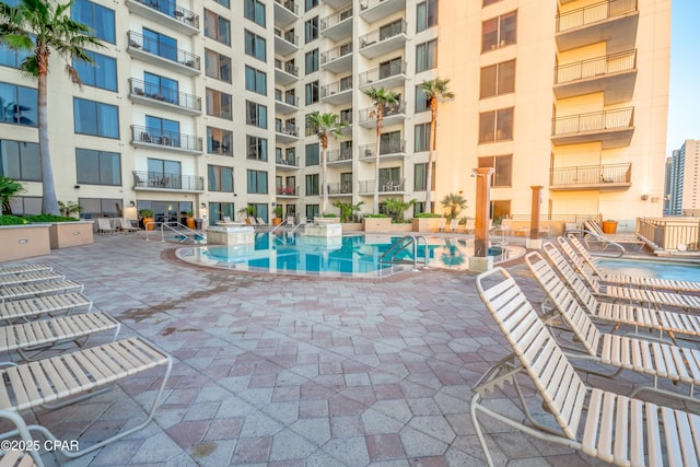 view of swimming pool featuring a patio area