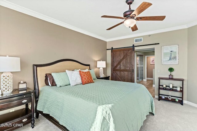 bedroom featuring a barn door, carpet floors, visible vents, baseboards, and crown molding