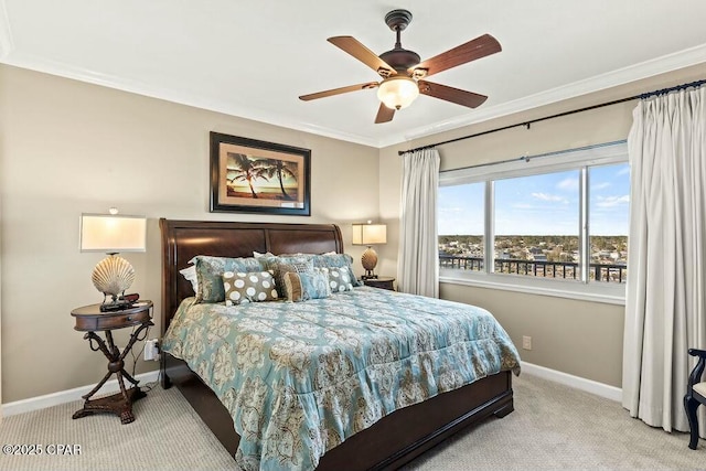 bedroom with carpet, crown molding, baseboards, and ceiling fan