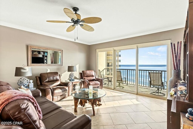 living area with light tile patterned floors, a ceiling fan, and crown molding