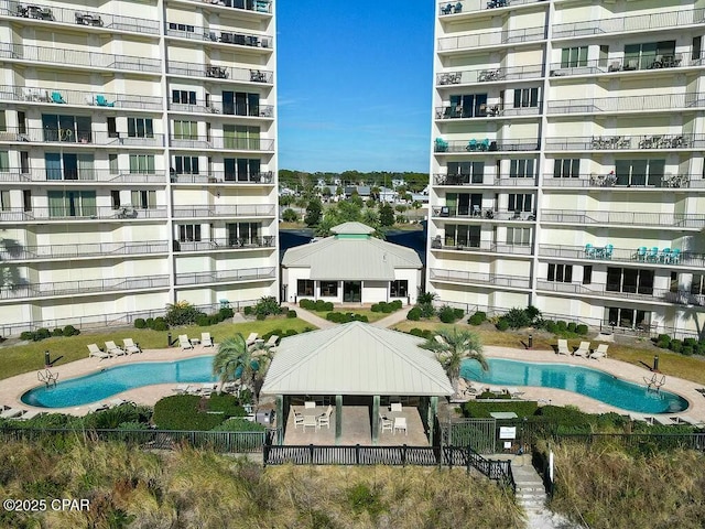 view of swimming pool with fence