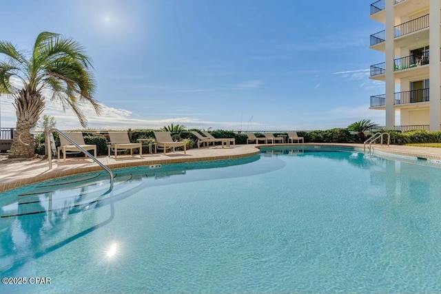 community pool with a patio