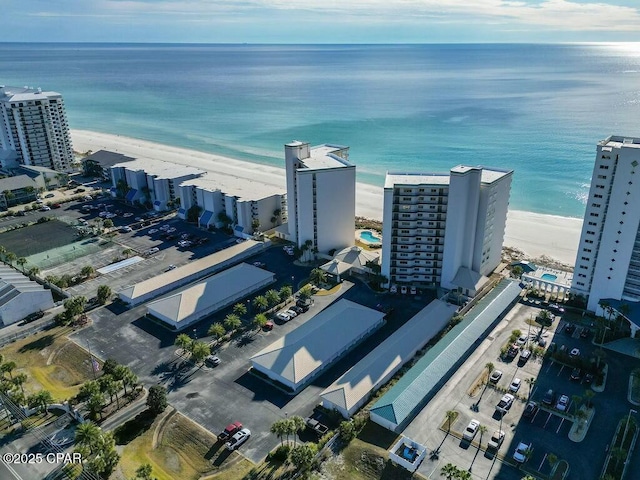 bird's eye view featuring a beach view and a water view