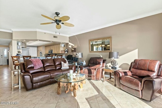 living area featuring ornamental molding, ceiling fan, and light tile patterned floors