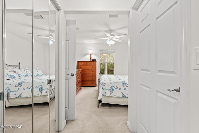 carpeted bedroom with ceiling fan