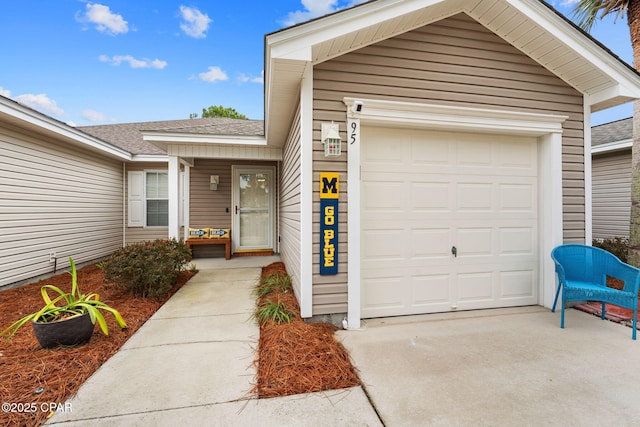 view of exterior entry featuring a garage