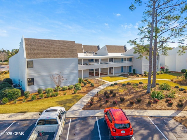 view of property with uncovered parking